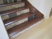 before stairs with dark maple treads, tile risers and light maple flooring